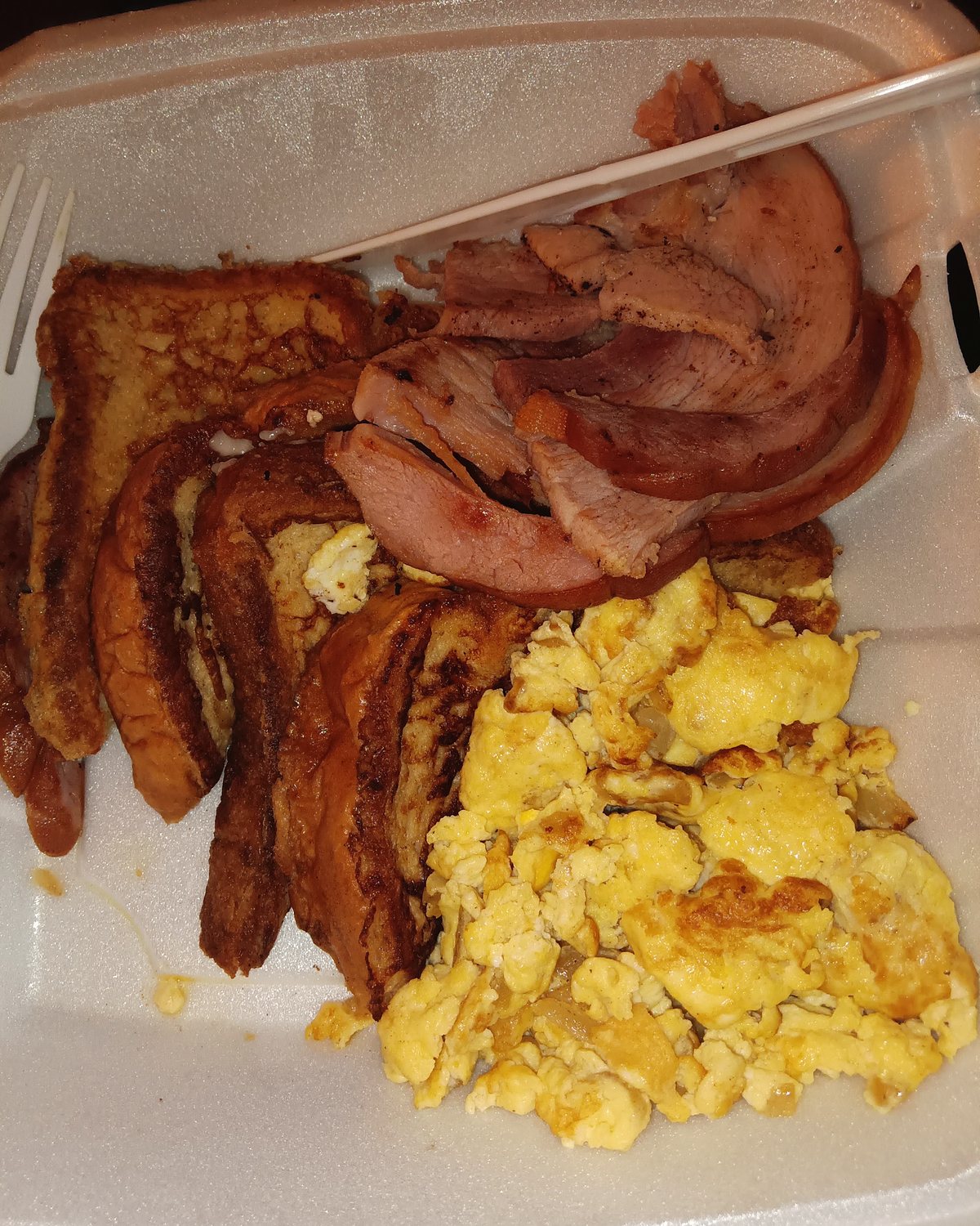 Breakfast at Geneva's: bacon, french toast and scrambled eggs.